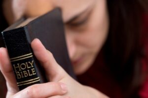 Woman-Praying-with-Bible.jpg